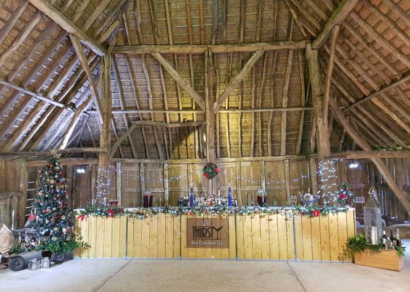 Versatile wooden event tent interior decorated for holiday celebration with festive Christmas decor.