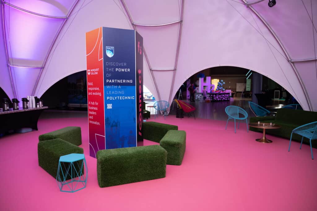 Other Rentals 1 Bright cloud tent wedding reception setup with colorful seating and branding, ideal for events and parties.