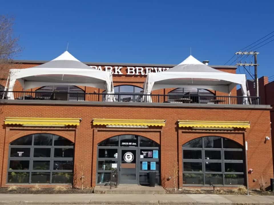 Other Rentals 4 High-quality event tents set up on a brick building's rooftop for outdoor celebration.