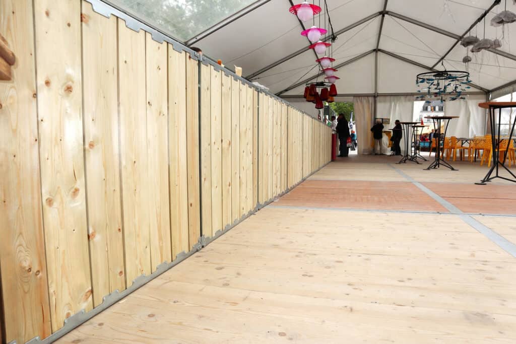 Wooden event tent flooring and interior setup by Superior Tent Rentals for outdoor gatherings and celebrations.