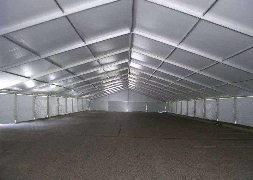 Large white event tent interior for rent, ideal for parties and gatherings.