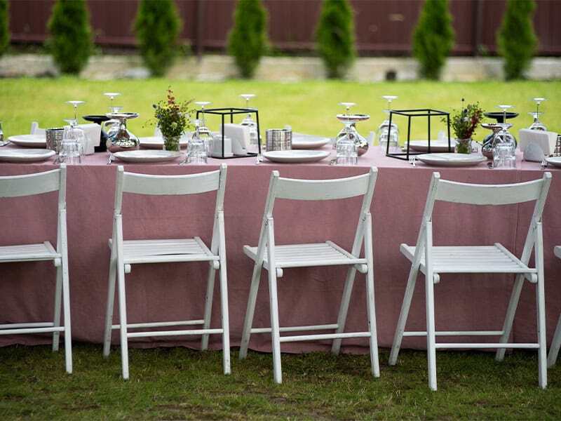 Elegant outdoor dining setup with tent rentals, perfect for events and parties.