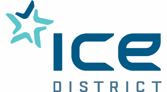 Colorful wedding tent setup with elegant drapery and lighting for outdoor events.