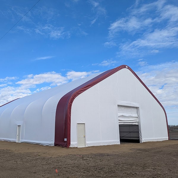 Large white and red event tent from Superior Tent Rentals, perfect for outdoor events, weddings, or parties. High-quality, durable rental tents ideal for any celebration or large gathering.