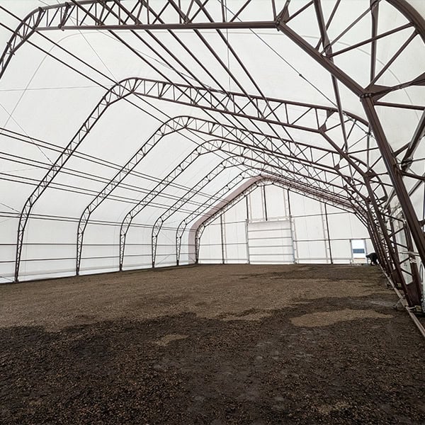 Heavy-duty event tent interior with metal frame and durable canopy, ideal for weddings, parties, and corporate events, provided by Superior Tent Rentals.